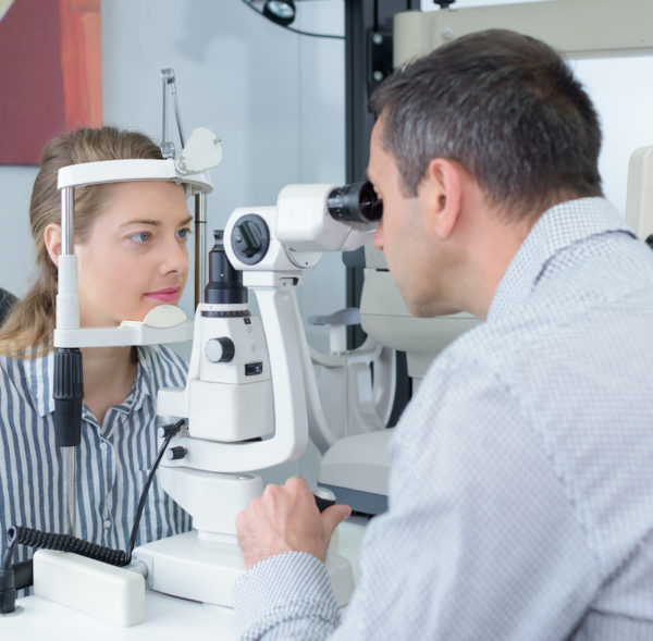doctor examing adult male patient